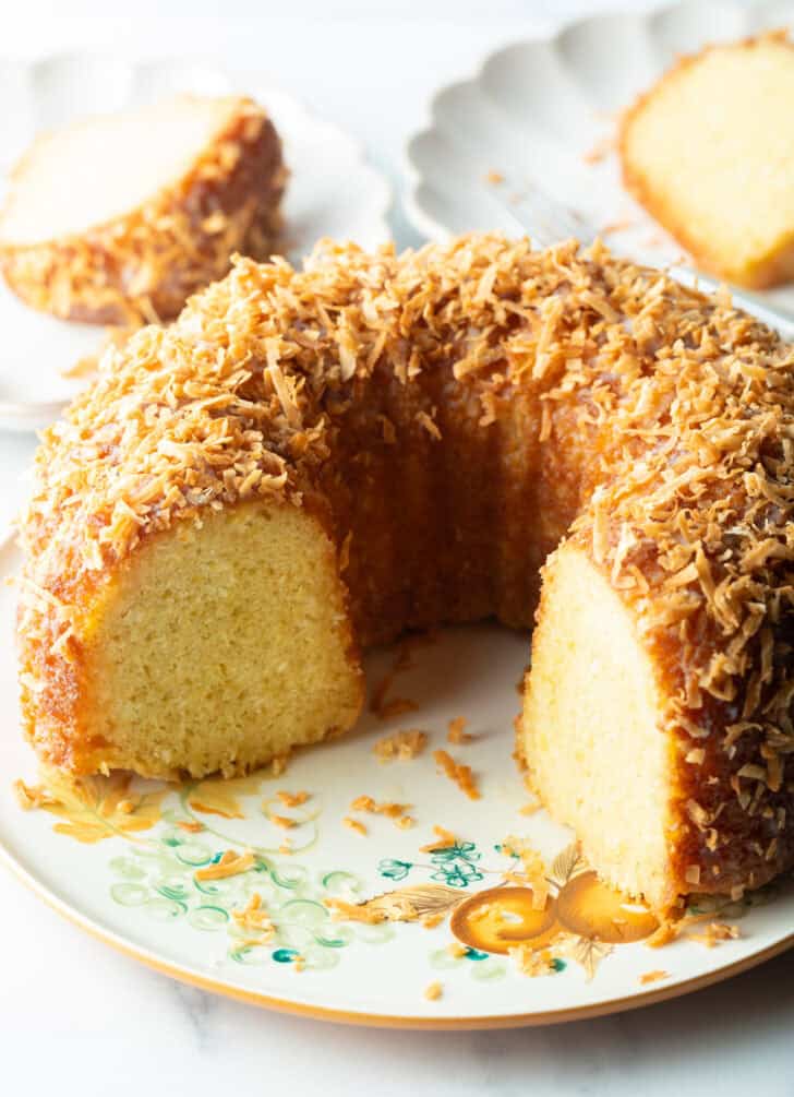 Caribbean rum bundt cake with a slice of cake removed.