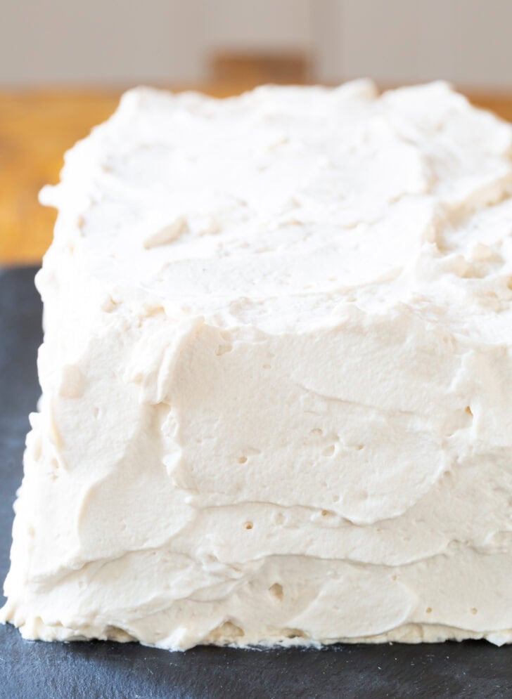 Rectangle cake frosted with whipped cream.