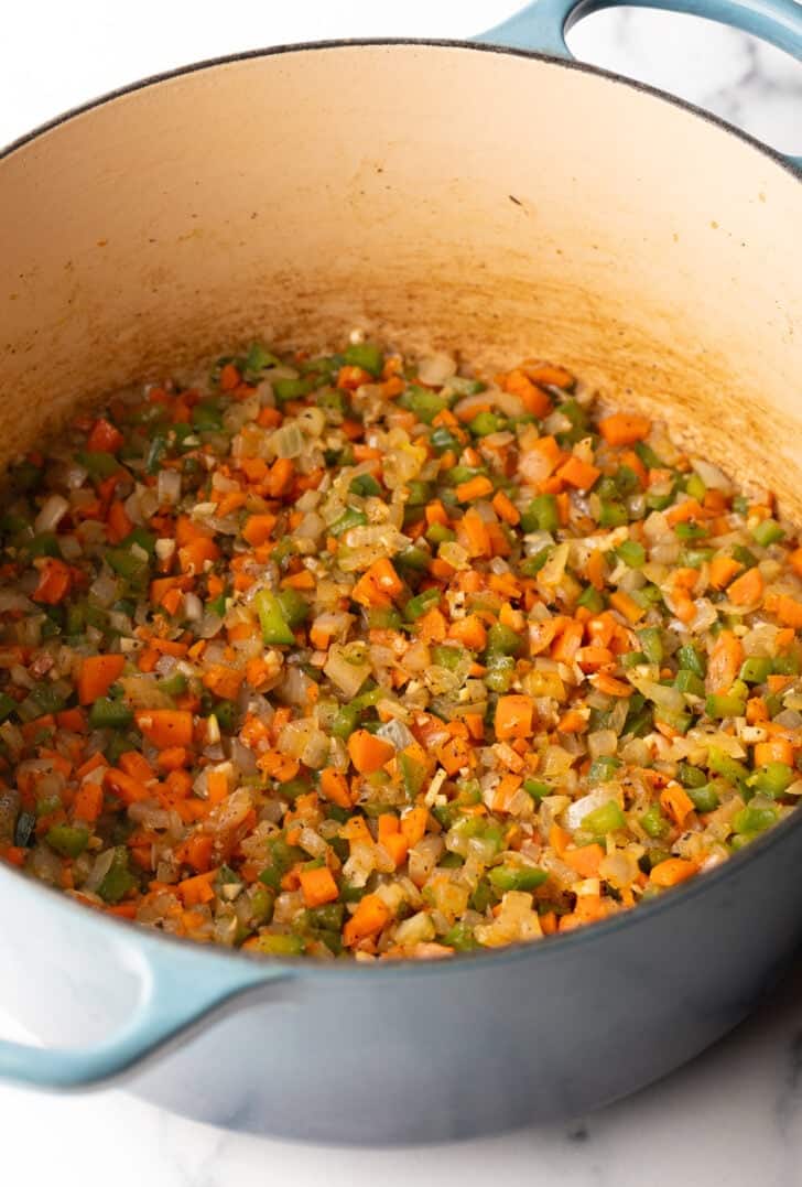 Large pot with chopped sauteed veggies.