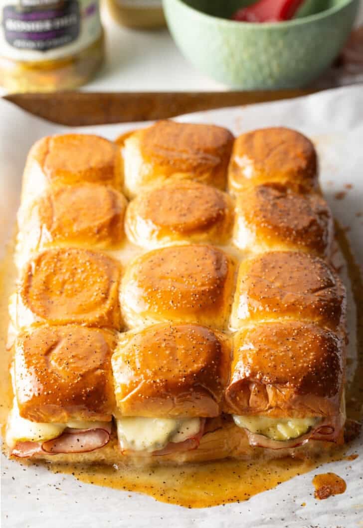 A dozen ham and cheese sliders made with king's Hawaiian rolls.