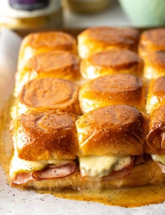 A dozen ham and cheese sliders made with king's Hawaiian rolls.