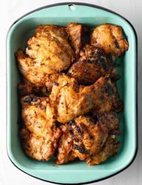 Top down view grilled skinless chicken thighs.