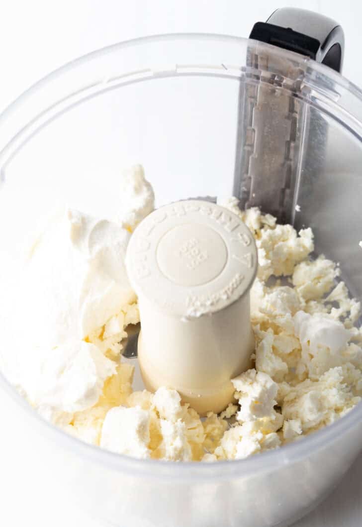 Crumble feta in a food processor.