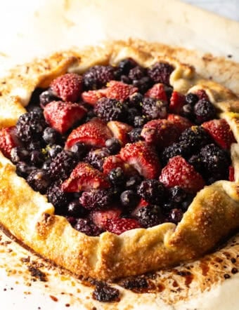 Baked crostata with blueberries, blackberries, and strawberries.