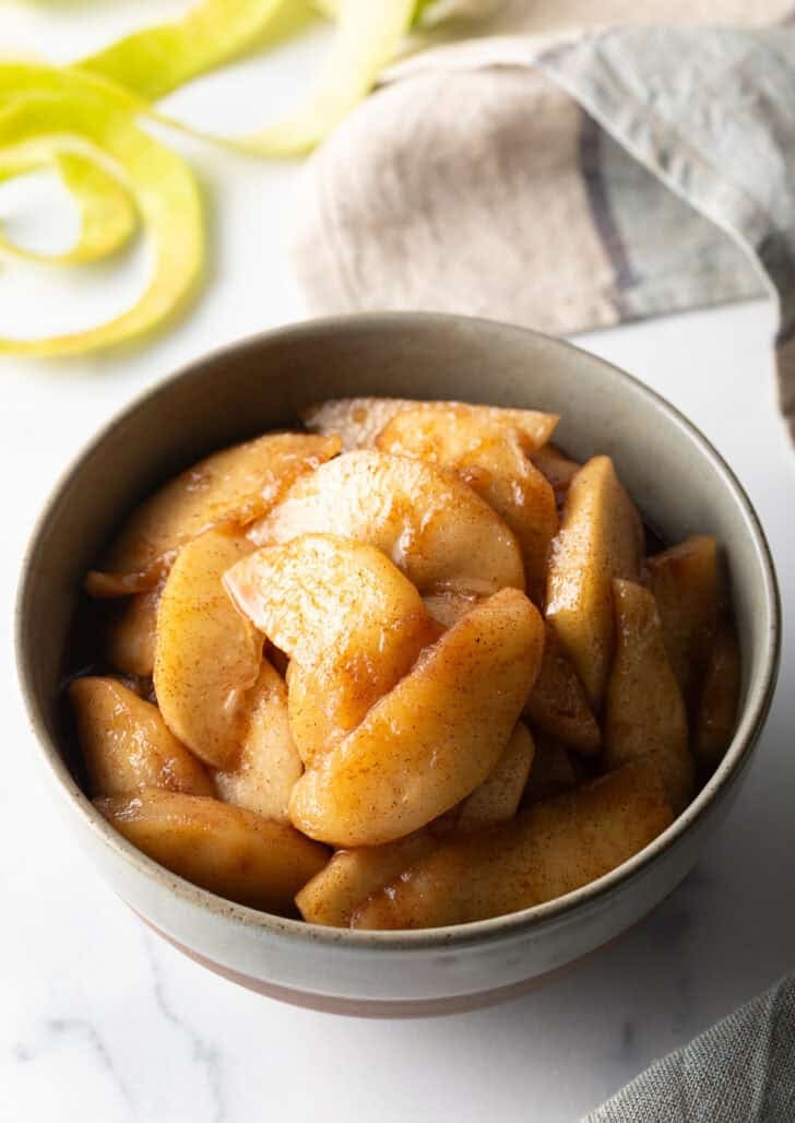 Serving of spiced apples in a gray bowl.