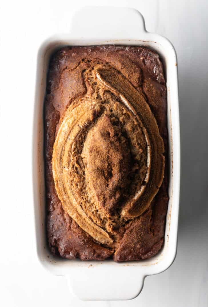 Top down white loaf pan with healthy banana bread.