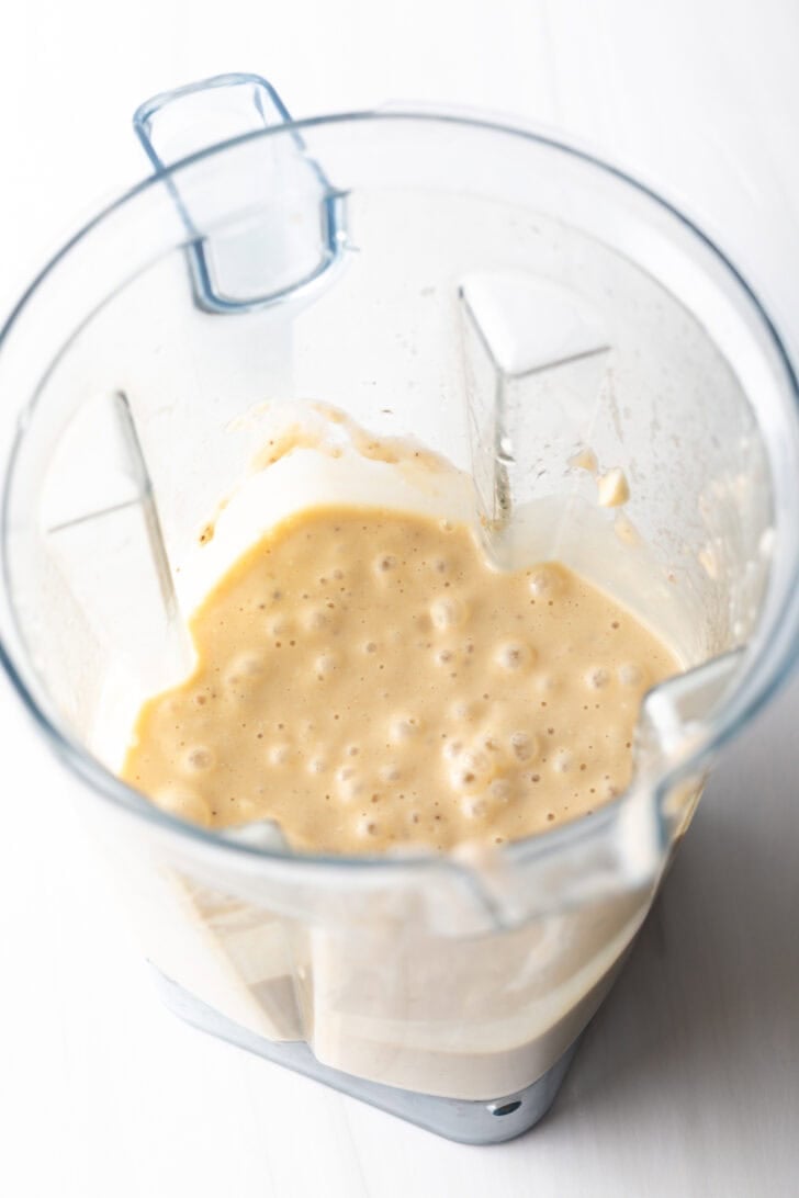 Blender jar with cottage cheese and egg combination.