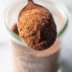 Spoonful of chicken taco seasoning held to camera.