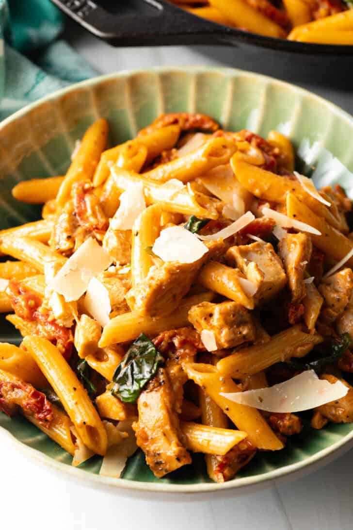 Green bowlful of marry me chicken pasta.