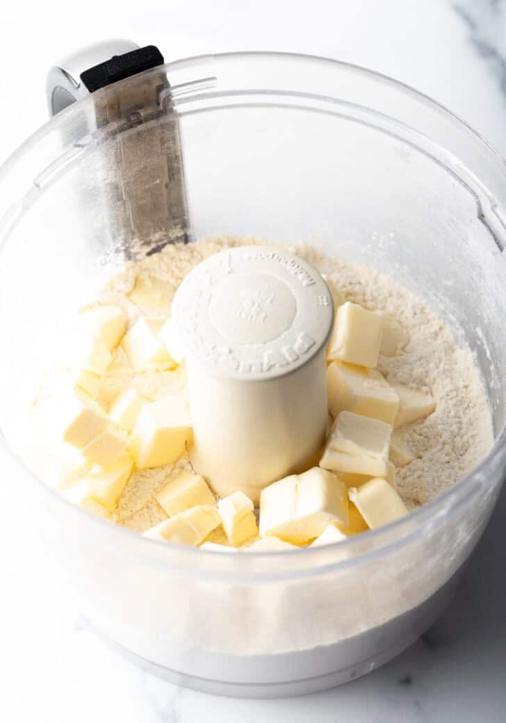 Cubes of butter and flour in a food processor.