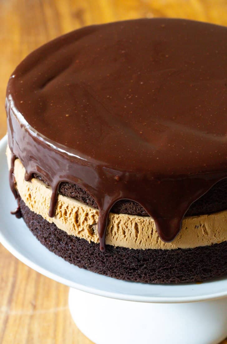 Chocolate and caramel ice cream cake covered with dripping chocolate ganache.