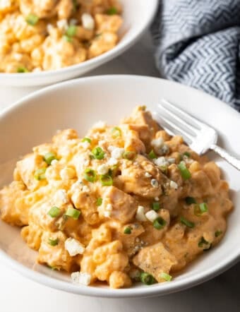White bowl of creamy cheesy buffalo chicken mac n cheese.