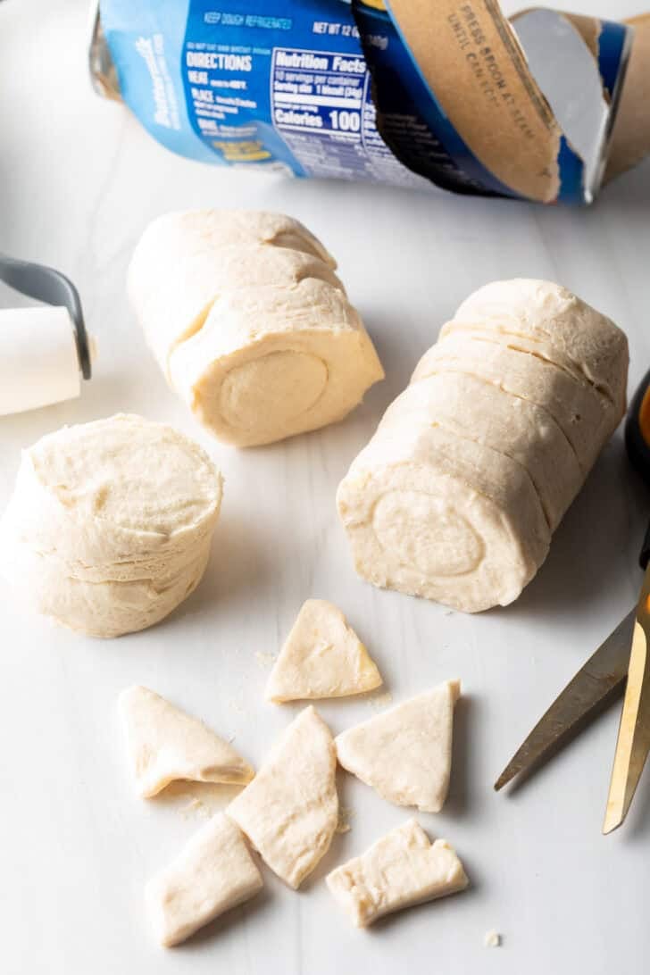 Pieces of biscuit dough cut into small triangles.