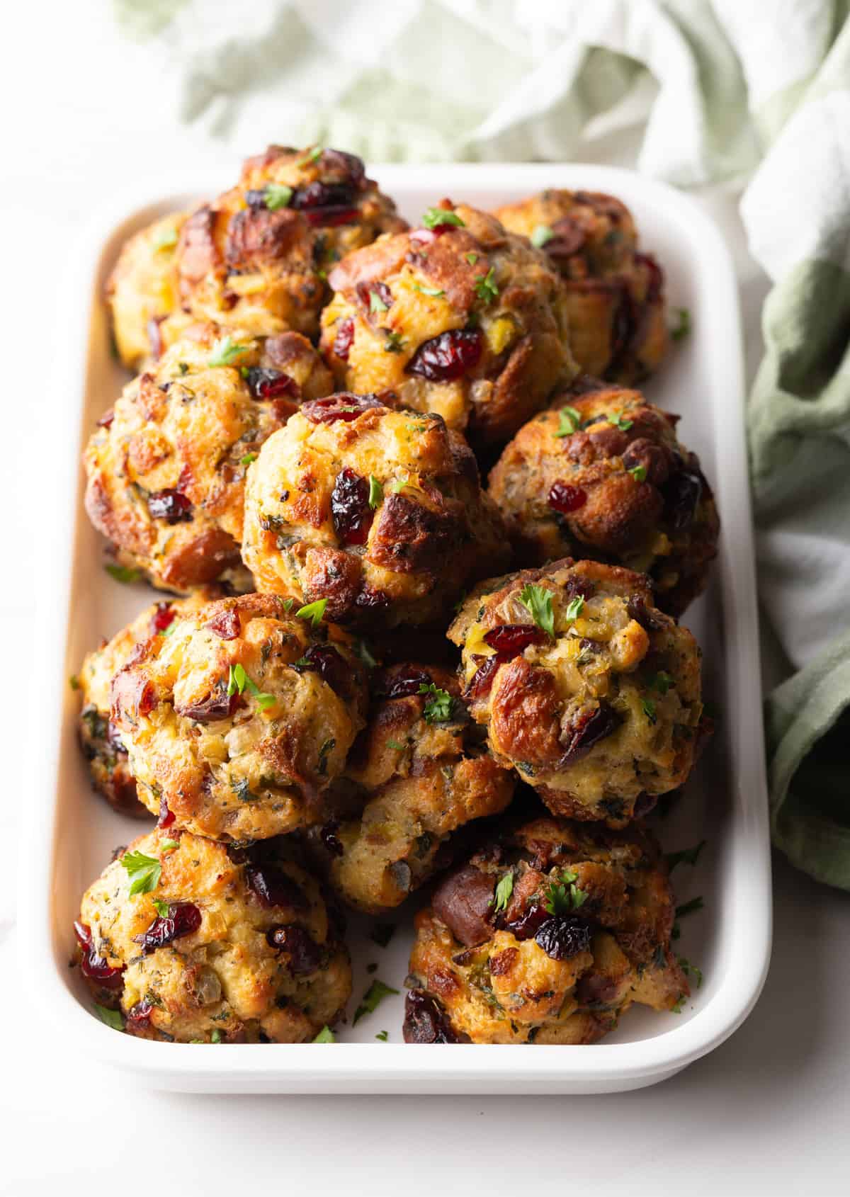 Top down view of a mound of stuffing balls in a white rectangle dish.