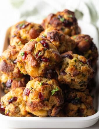 Top down view of a mound of stuffing balls in a white rectangle dish.