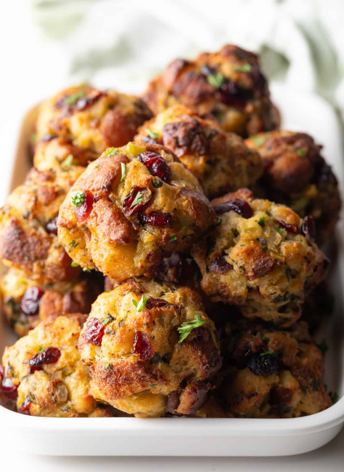 Top down view of a mound of stuffing balls in a white rectangle dish.