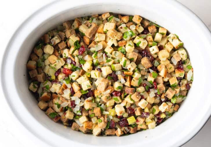 Crock pot dressing fully assembled and ready to be cooked in the slow cooker.