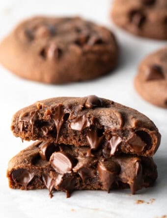 Chocolate nutella cookie broken in half, stacked on top of each other.