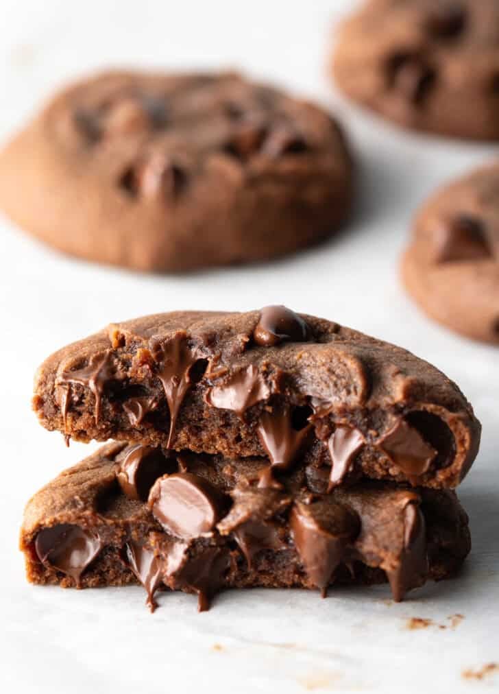 Chocolate nutella cookie broken in half, stacked on top of each other.