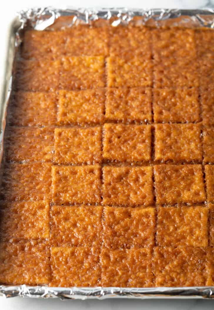 Baking sheet covered with toffee-soaked saltine crackers.