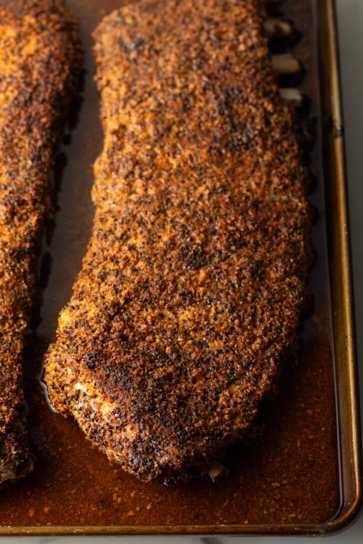 St Louis ribs in oven tray after being cooked.