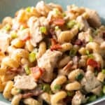 chicken bacon ranch pasta in light blue bowl, close up, showing all ingredients