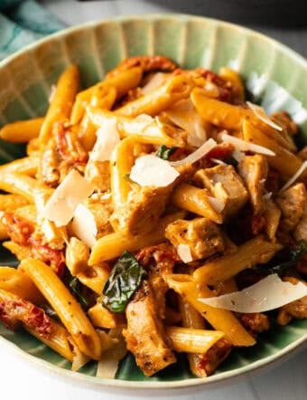 Green bowlful of marry me chicken pasta recipe.