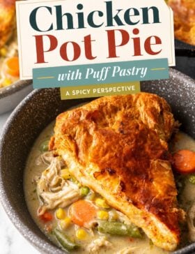 Single image poster of chicken pot pie with puff pastry in a cast iron skillet, styled in warm golden, deep red, teal, and olive tones with a flaky golden-brown crust on top.