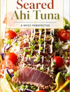 Single-image poster of sesame-crusted seared ahi tuna slices fanned on a plate, styled in warm gold (#D8B412), deep red (#B9412C), teal (#67B0AB), and olive (#89883C) tones.