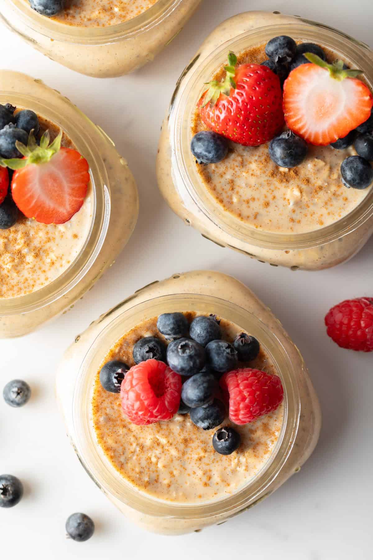 easy overnight oatmeal in small jars with berries