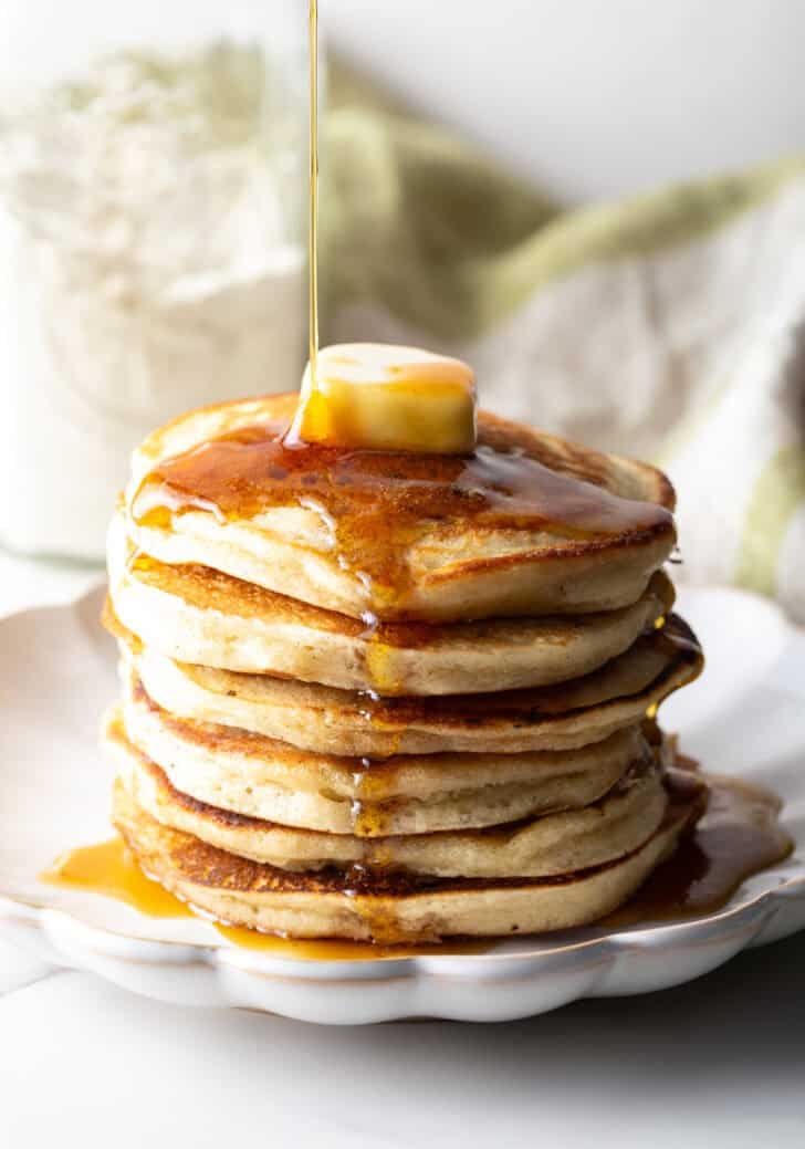 A fluffy stack of pancakes with butter and syrup, made with a homemade pancake mix recipe.