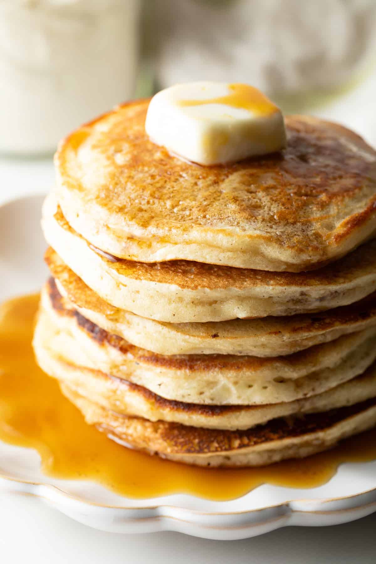 A fluffy stack of pancakes with butter and syrup, made with a homemade pancake mix recipe.