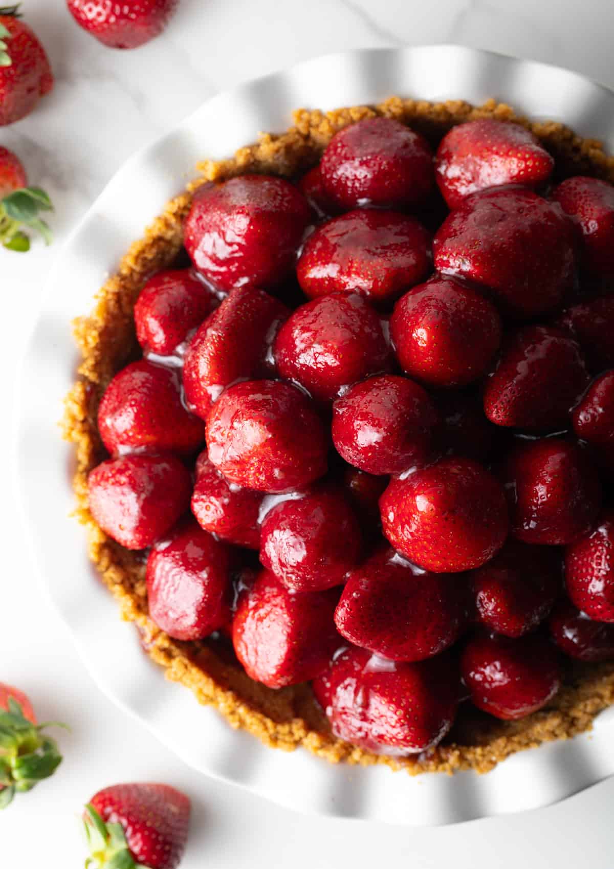 A fresh strawberry pie loaded with glazed strawberries.