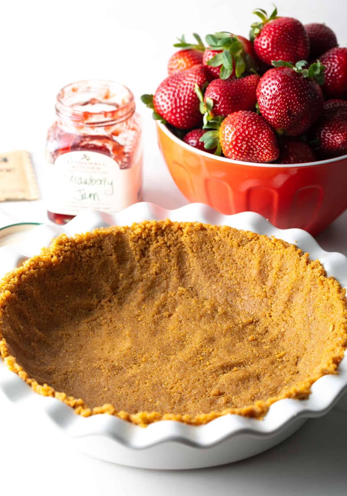 A no-bake strawberry pie crust in a pie pan.