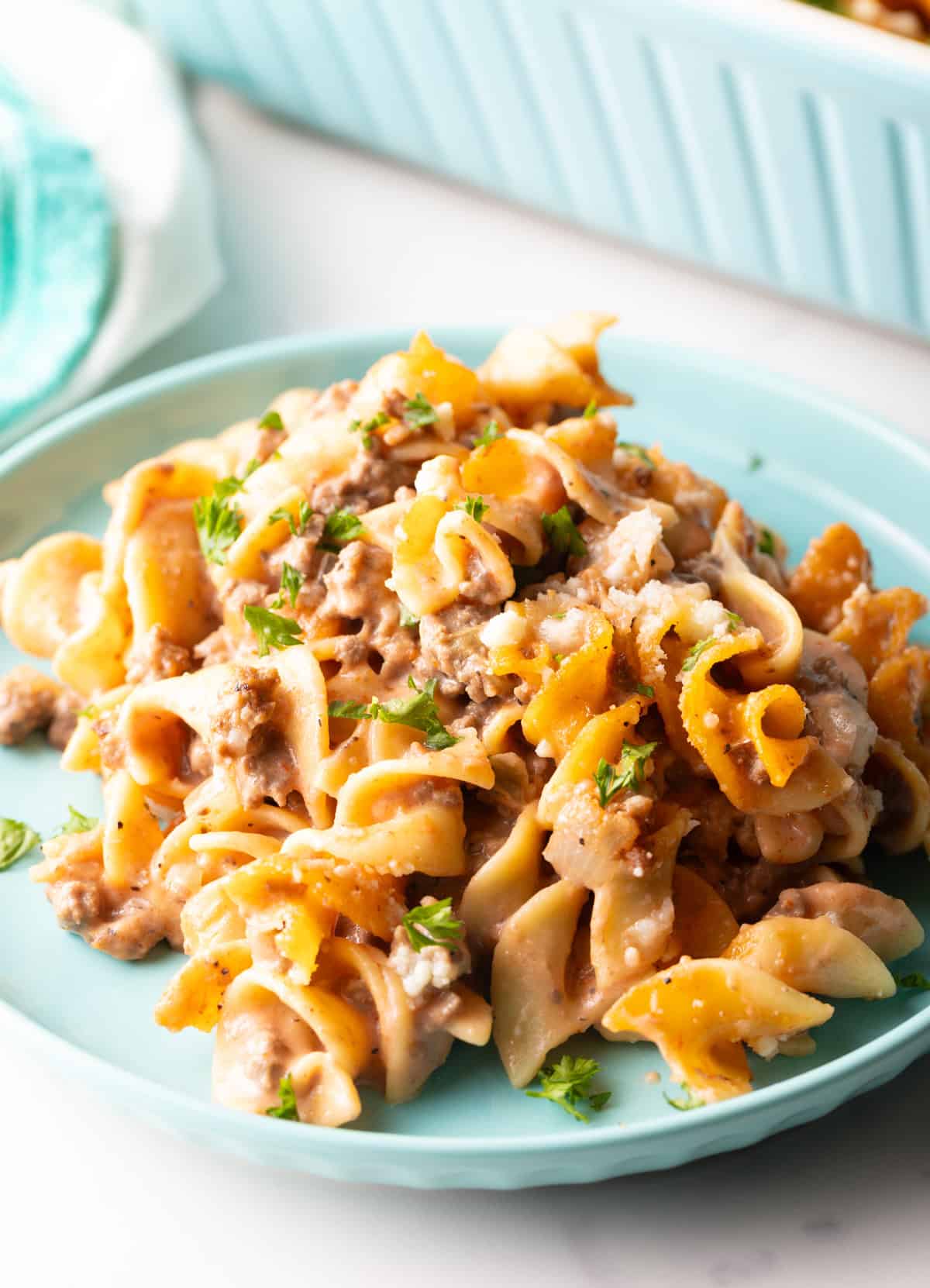 A blue plate topped with a serving of Amish country casserole.