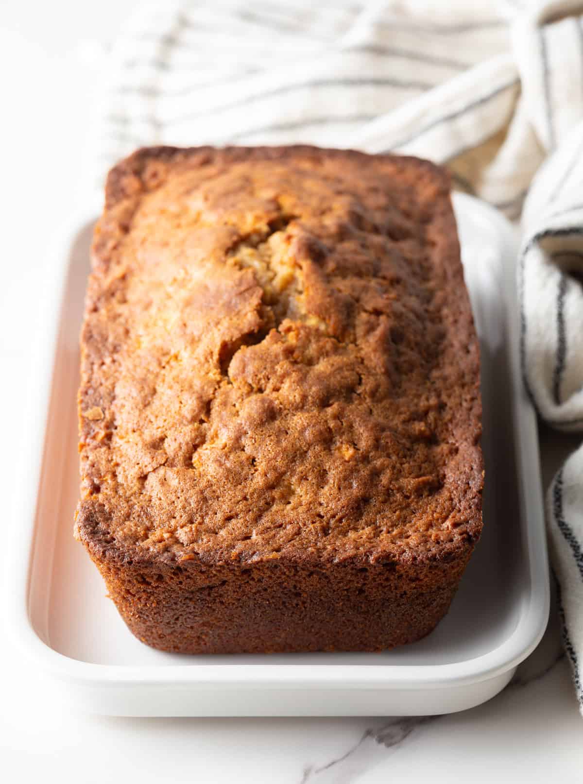 Loaf of apple bread in the pan.