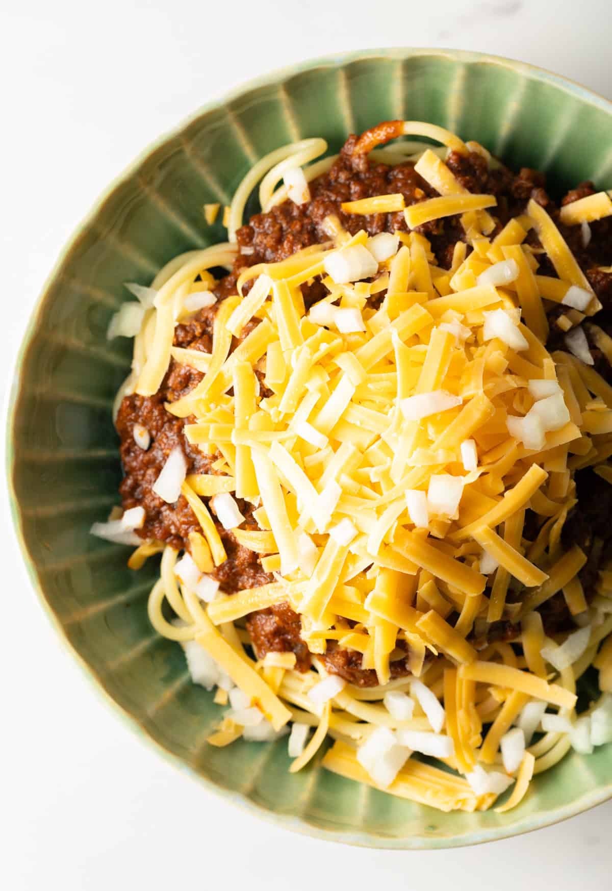 An overhead shot of a bowl of a Cincinnati chili recipe.