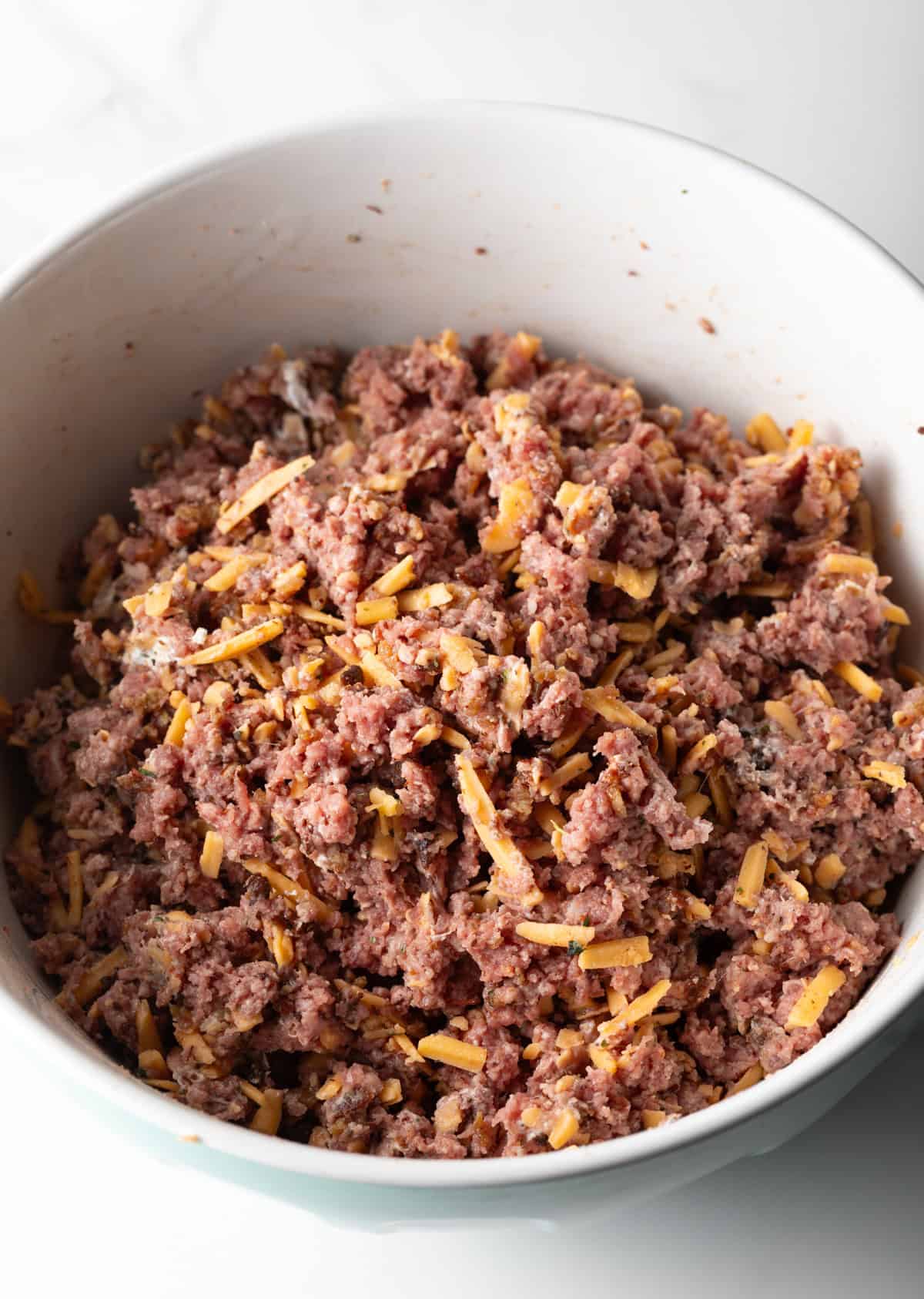 A beef crack burger mixture sitting in a white bowl.
