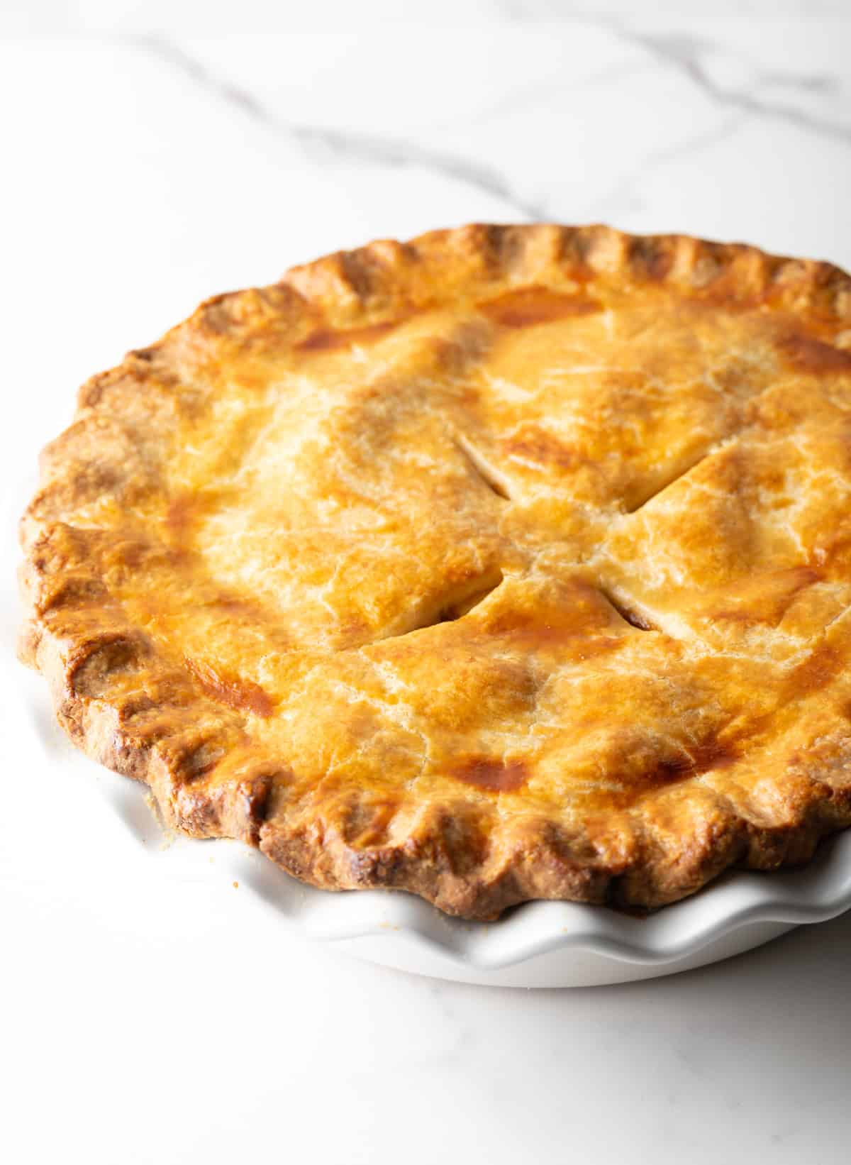 An overhead shot of a full homemade apple pie recipe.