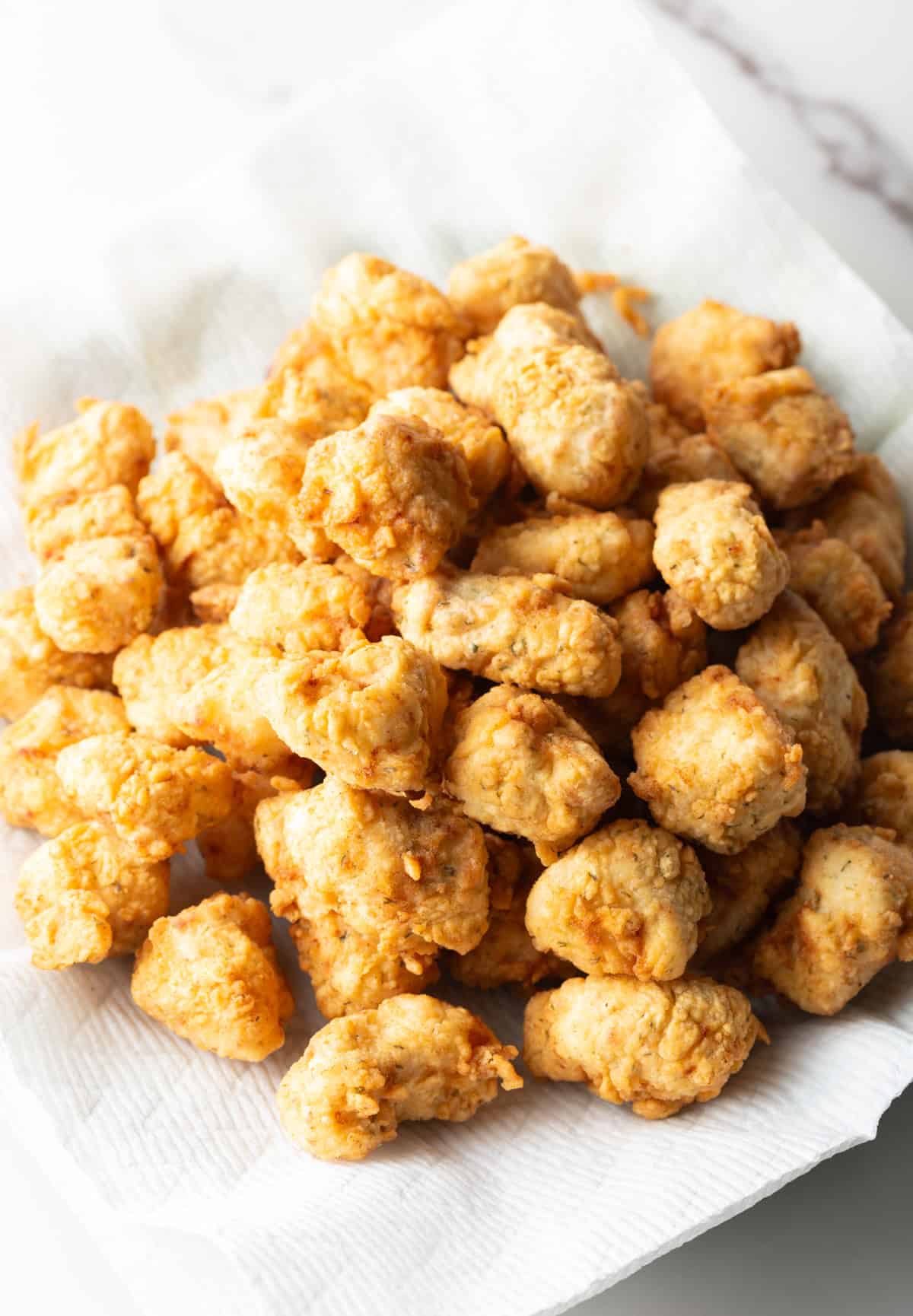 A white bowl filled with a crispy fish bites recipe.