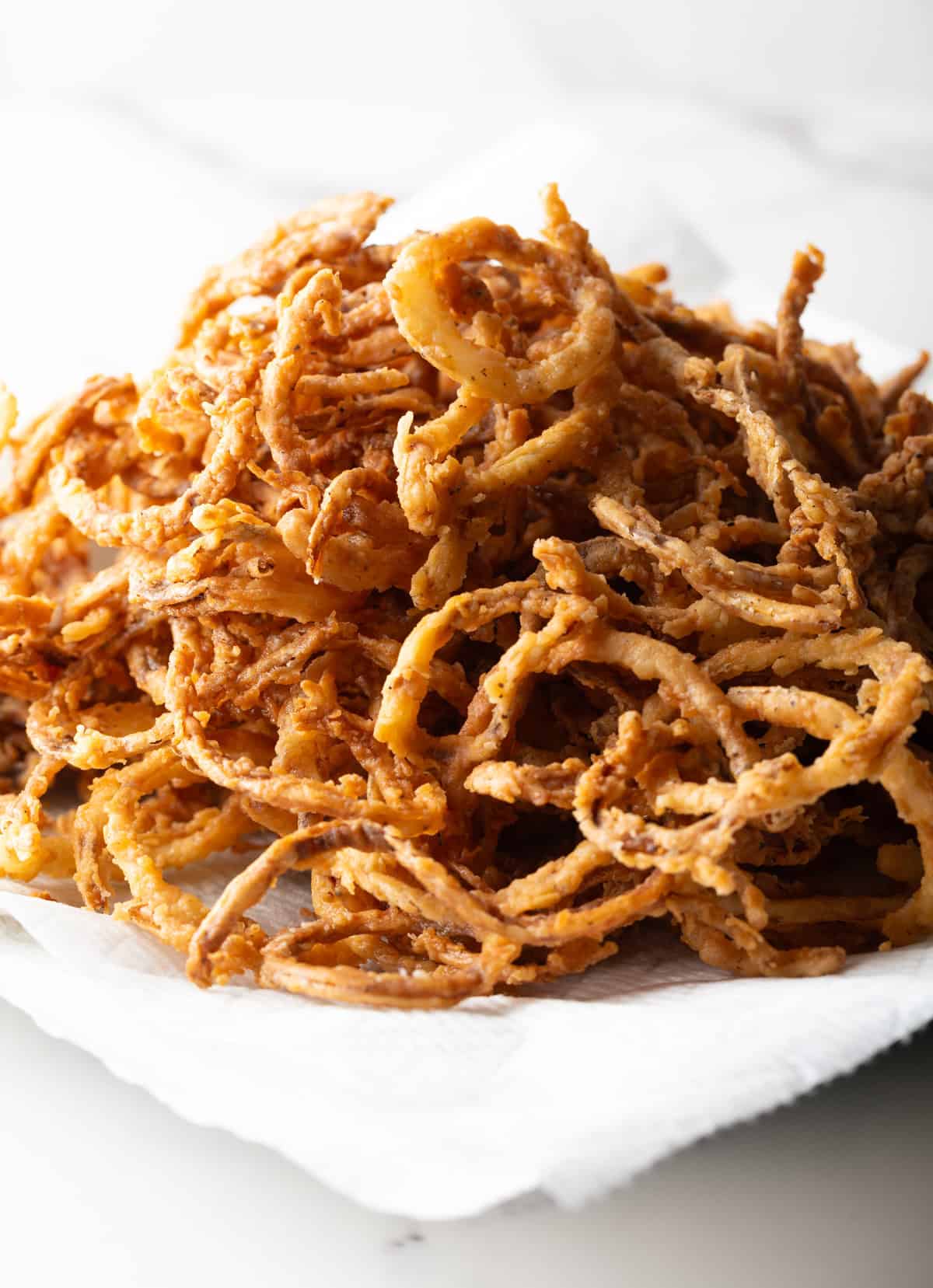 A copycat of French's fried onions recipe sitting on a white plate.