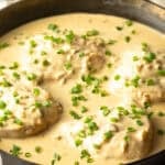 A black skillet filled with a creamy jalapeno chicken recipe.