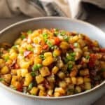 A bowl filled with a homemade potatoes O'brien recipe.
