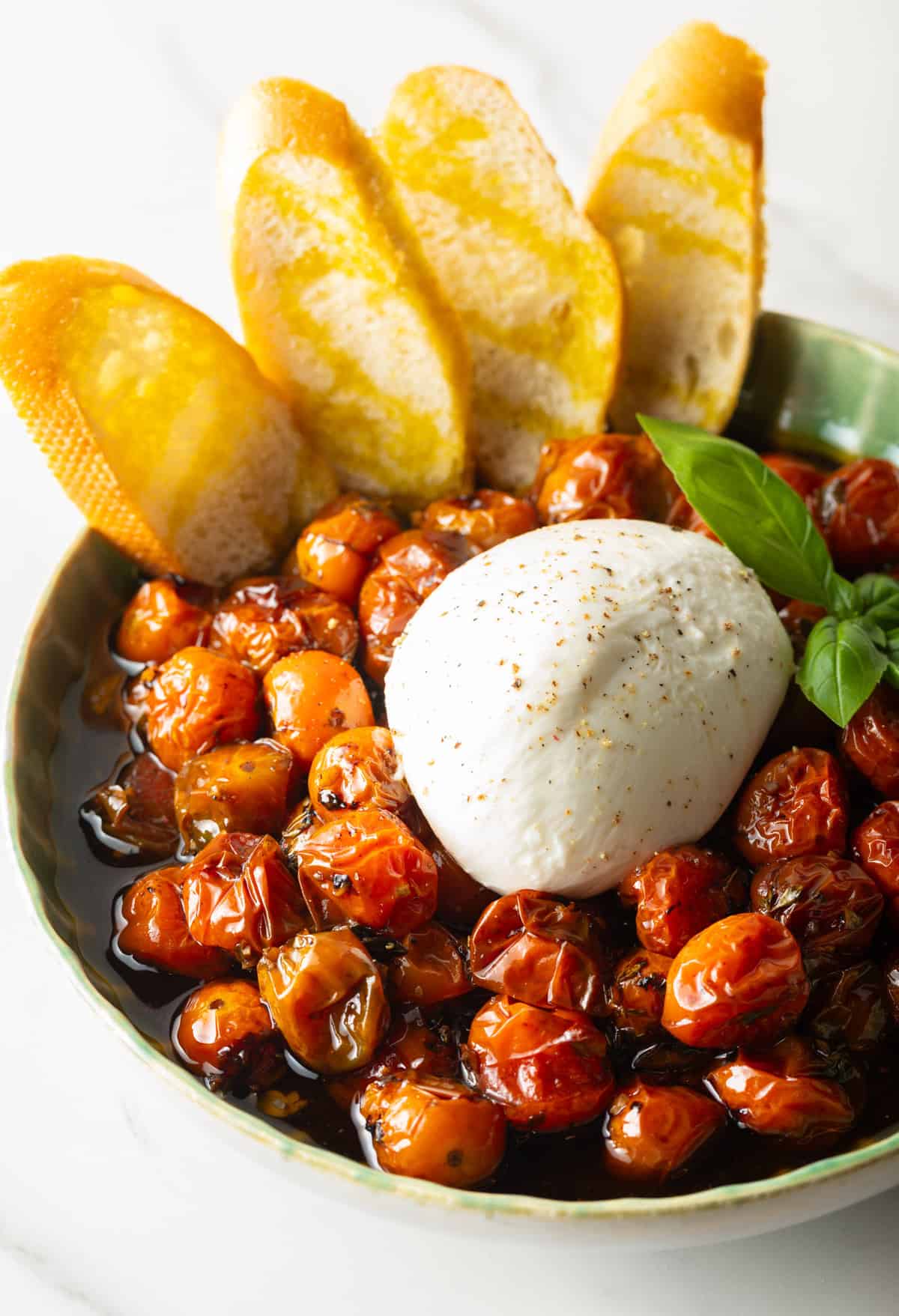 roasted cherry tomatoes with burrata ball and crostini 