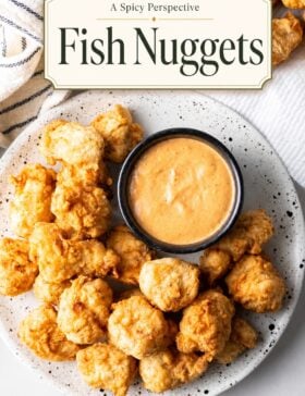Single-image poster of golden crispy fish nuggets in warm amber (#D8B412), deep red-spice (#B9412C), coastal teal (#67B0AB), and olive herb (#89883C) tones, styled on a rustic surface with dipping sauce.